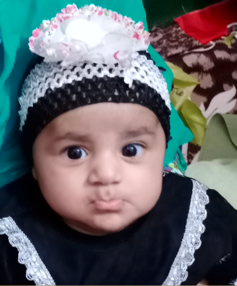 baby boss of Pakistan having a poker face